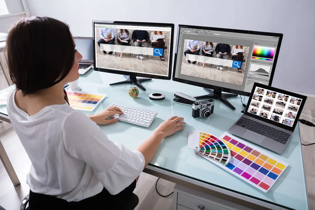 Graphic designer working on a laptop with advanced technology provided by Managed Services Australia in Melbourne