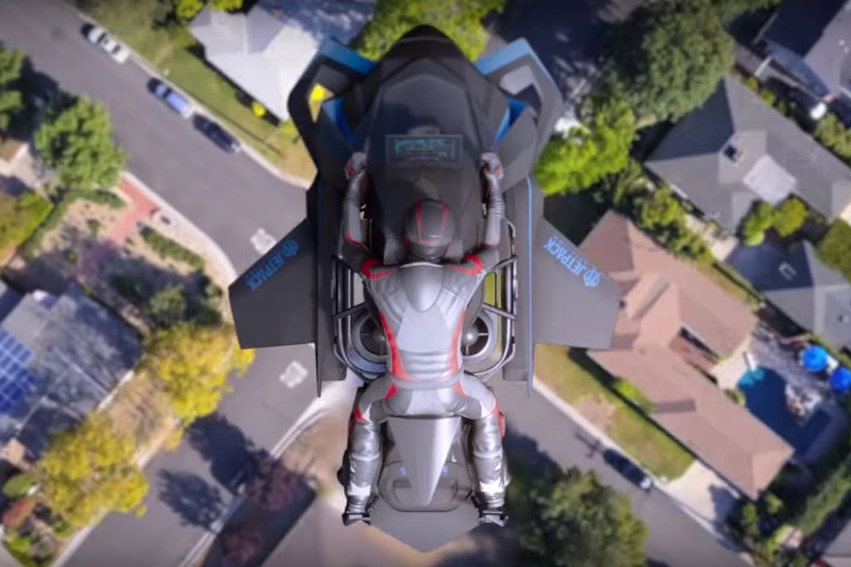 Jet powered flying motorcycle in action over Melbourne skyline