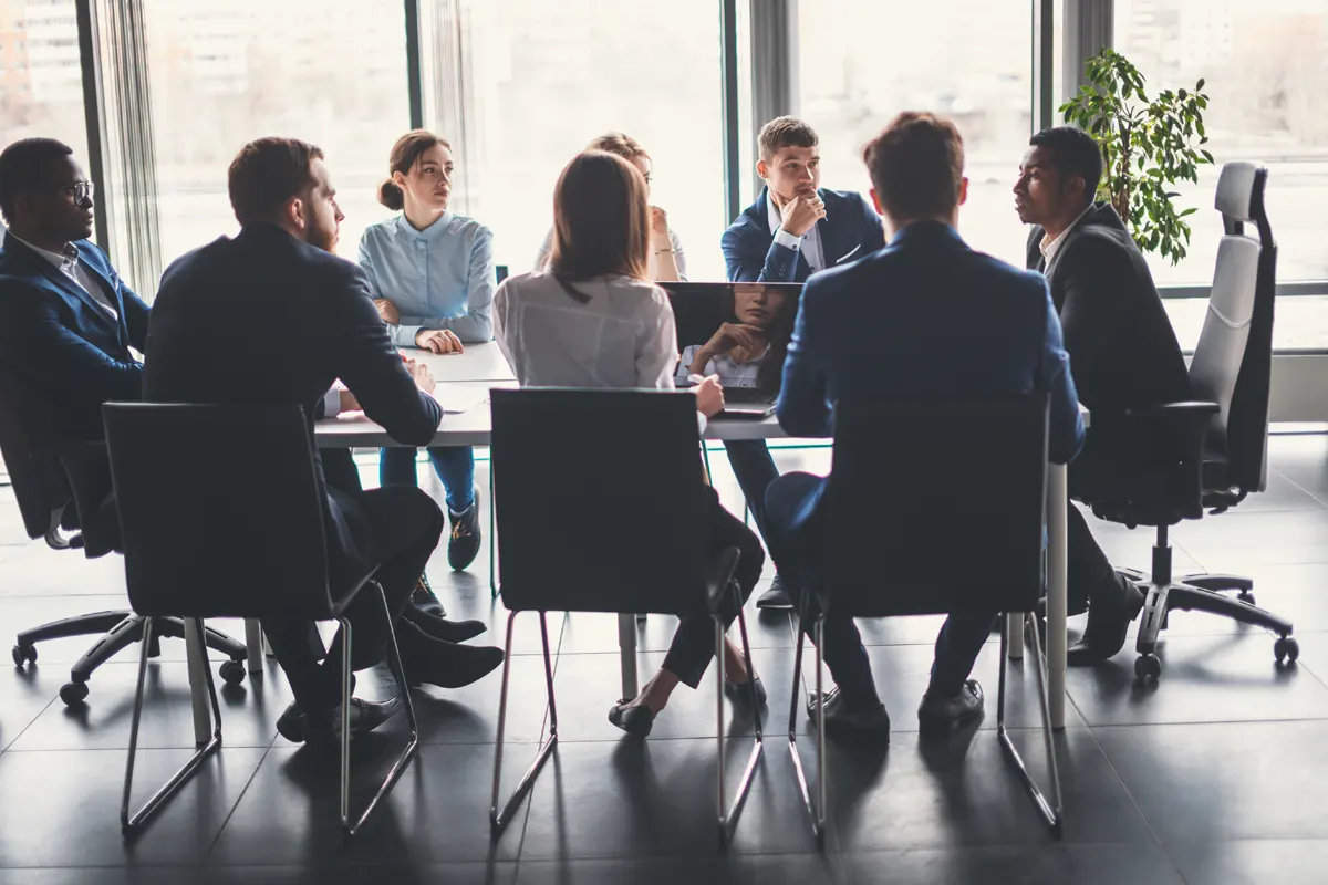 A photograph of a group of professional services executives in a boardroom presentation, using technology supplied by Managed Services Australia in Melbourne.