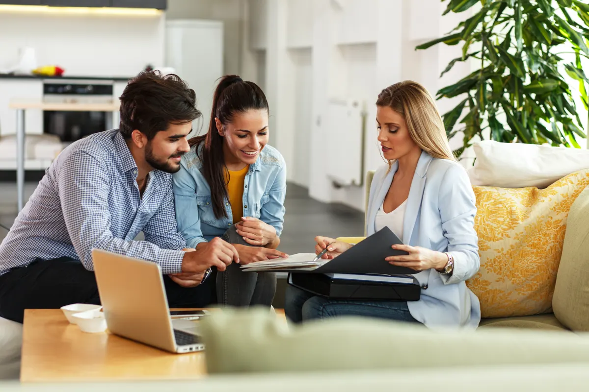 A real estate agent using technology to assist clients in purchasing a home in Melbourne