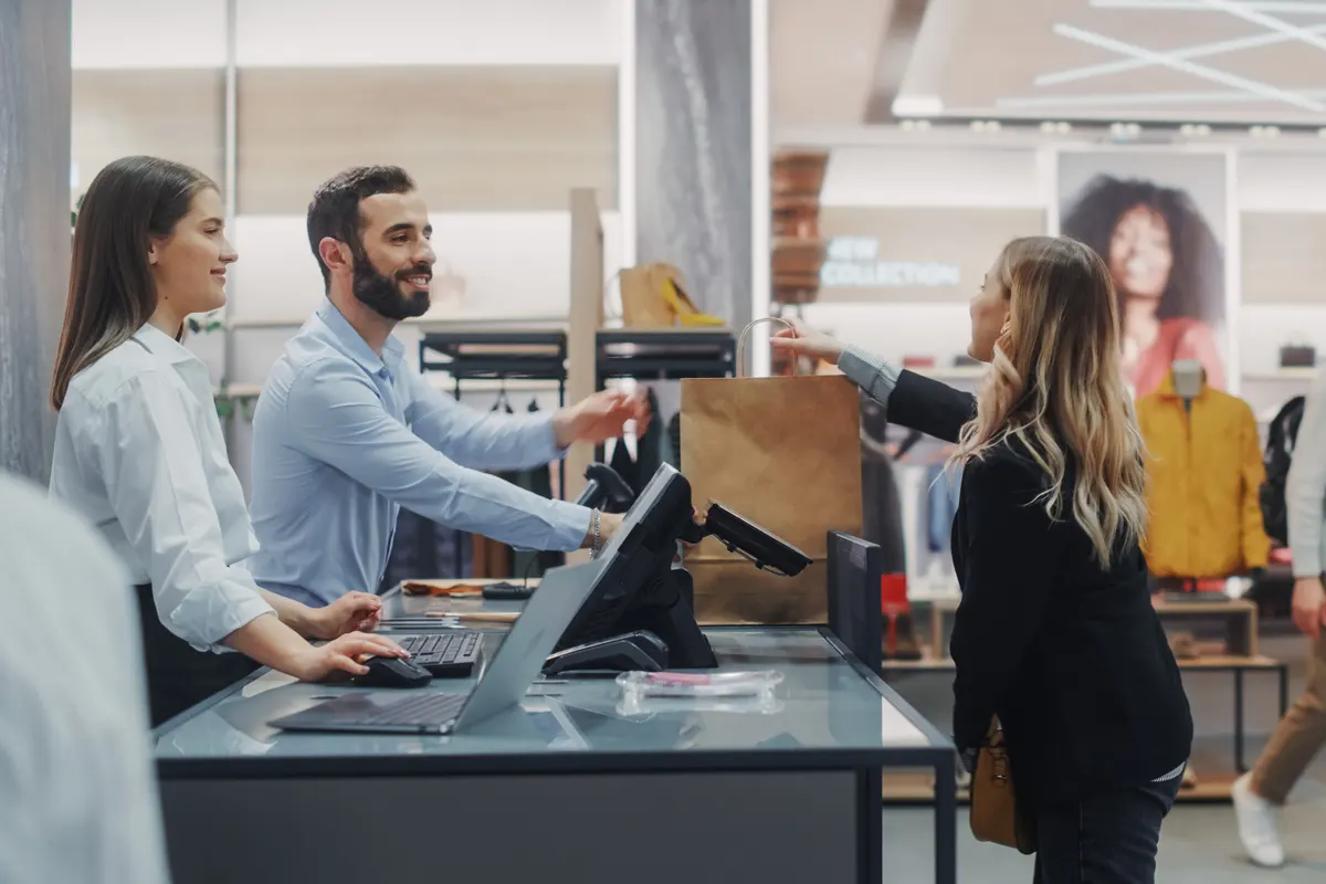 A customer making a purchase at a retail store using advanced technology provided by Managed Services Australia in Melbourne.
