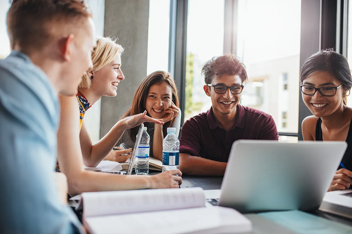 A group of students working together on a project in a university classroom in Melbourne