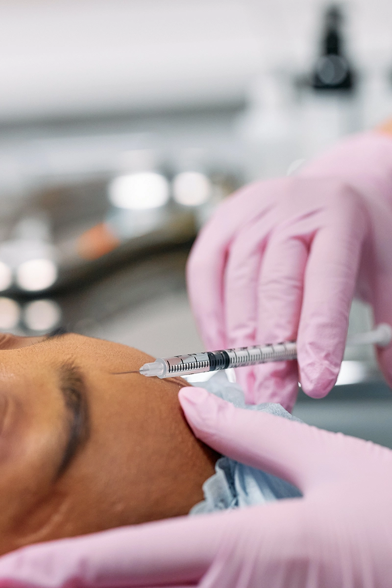 Enhanced Patient Experience with Managed IT Services in Melbourne’s Leading Cosmetic Surgery Clinic. Patient receiving Botox treatment at a Melbourne cosmetic surgery clinic, IT and telecommunication services by Managed Services Australia.