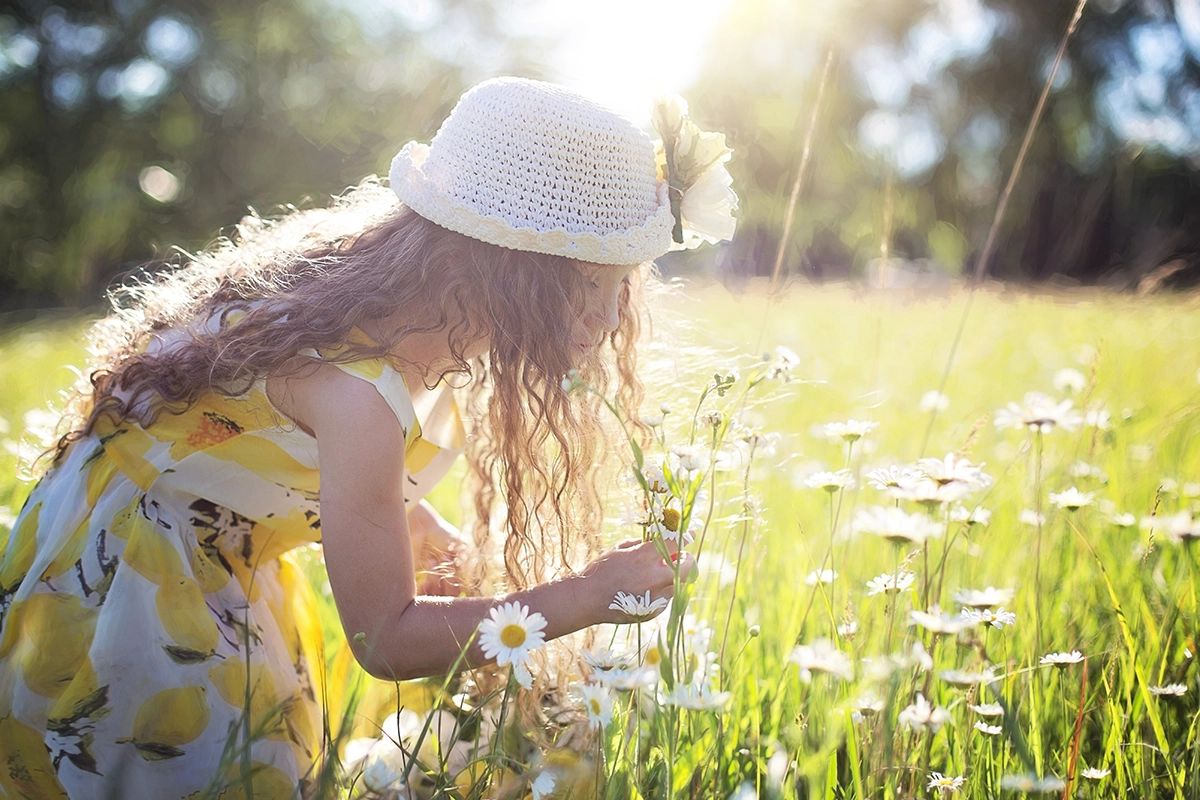 Girl_holding_flowers_in_flower_field_Managed_Services_Australia