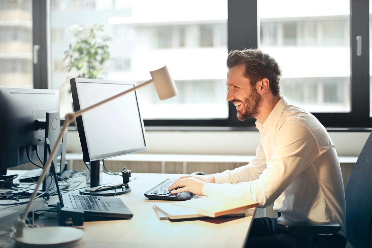 Image of a professional working on a computer, symbolizing efficiency and security with Managed IT Services.